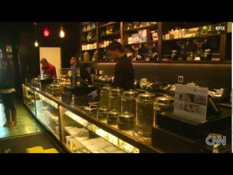 Girl Scout sells cookies by pot store